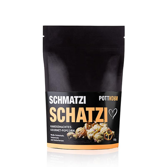 Luftiges Popcorn mit weißer belgischer Schokolade, kleinen Zuckerherzen und Salzbrezeln