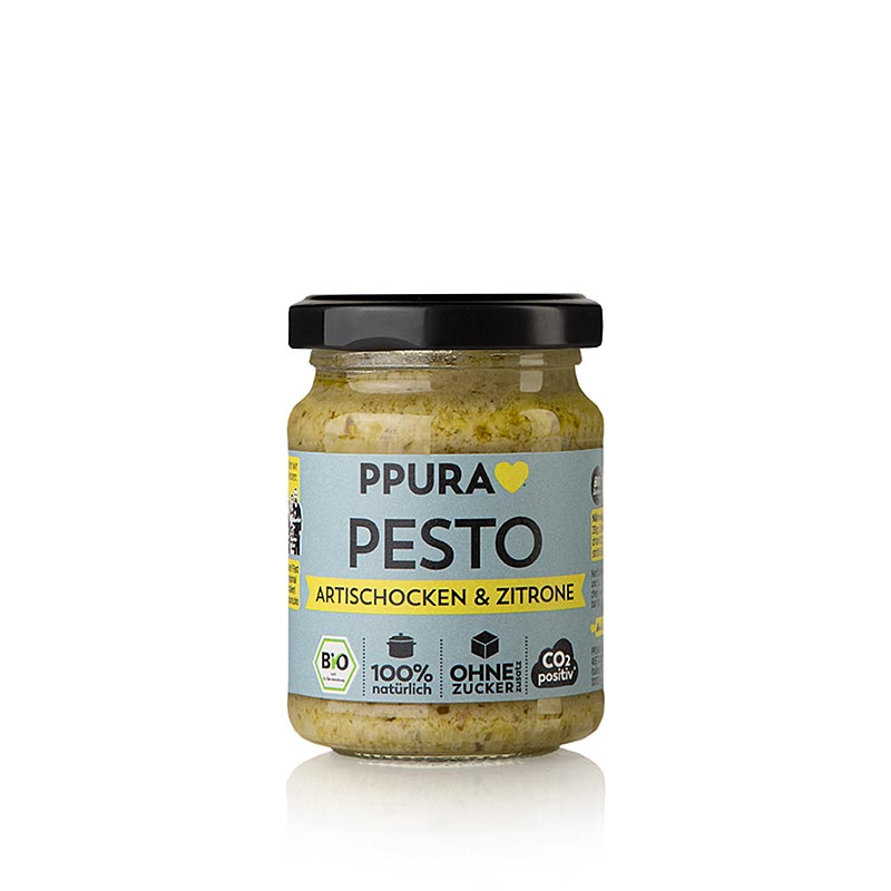 Glas mit 120 g Ppura Pesto von Artischocke, Petersilie und Zitrone, Bio-Produkt, IT-BIO-006, das an eine dampfende Schüssel Pasta in einem toskanischen Garten erinnert, liebevoll zubereitet wie von Nonna