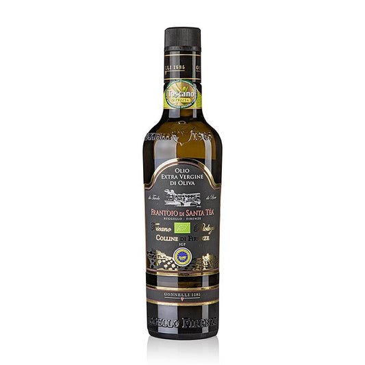 Flasche natives Olivenöl Extra Santa Tea Gonnelli Colline di Firenze IGP, BIO, 500 ml, umgeben von grünen Olivenzweigen auf einem rustikalen Tisch