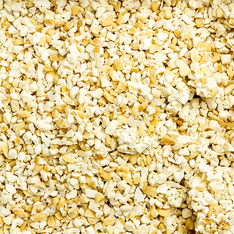 Nougat français de Montélimar grossièrement râpé, fabriqué à partir d'amandes grillées, de sucre, de miel et de beurre de cacao, à l'arôme naturel de vanille, idéal pour les glaces, les pralines et les crèmes.