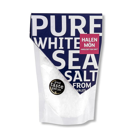 Halen Môn, Flocons de sel marin du Pays de Galles, 100 g - Des flocons de sel blancs et croustillants, récoltés autour de l'île d'Anglesey au Pays de Galles, donnent à chaque plat le goût de l'océan le plus pur.