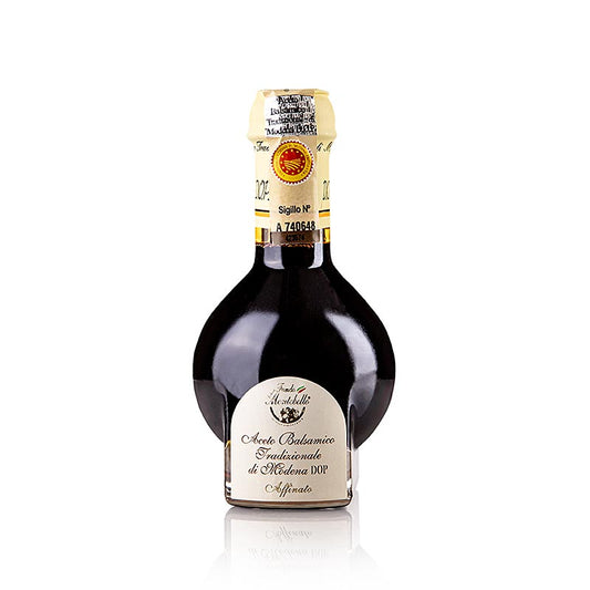 Aceto Balsamico di Modena Tradizionale Affinato DOP/gU, 12 J, 100 ml - Vinaigre balsamique de 12 ans d'âge, au goût complexe et intense, avec des notes de fruits secs et de bois, produit à Modène, en Italie, selon des méthodes traditionnelles Parfait pour agrémenter les salades, les viandes, les poissons et les desserts Contenu : 100ml