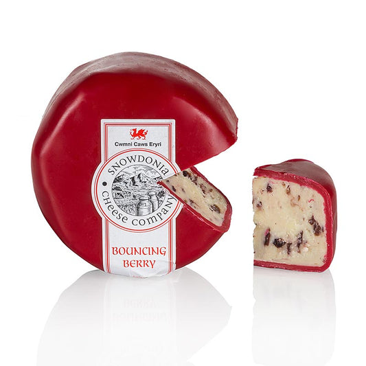 Snowdonia - Bouncing Berry, Cheddar aux cranberries, cire rouge, 200 g : Cheddar blanc crémeux avec des cranberries rouges intégrées, parfait pour les plateaux de fromages d'été ou les salades, recommandé avec un Chardonnay croquant