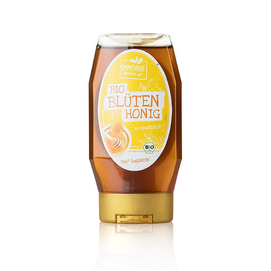 Miel de fleurs bio en bouteille squeeze pratique, idéal pour sucrer le thé ou le pain