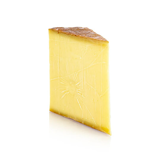 Image d'un fromage de montagne Sibratsgfäller de 500g au lait de vache, affiné au moins 16 mois, produit par la fromagerie du village de Sibratsgfäll dans le Bregenzerwald, Vorarlberg, Autriche