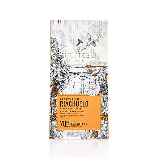 Tablette de chocolat de plantation Riachuelo, 70% amer, Michel Cluizel (12159), 70 g : chocolat de la région de Bahia au Brésil, entouré de la forêt atlantique et d'une flore exotique, avec des saveurs de cacao grillé, de fruits secs et un arrière-goût fruité de paprika.