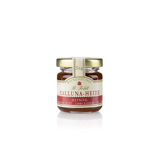 Pot de 50 g de miel de bruyère Calluna de l'apiculture Feldt, riche en antioxydants et au goût caractéristique légèrement amer, parfait pour affiner les plats ou pour tartiner sur du pain.