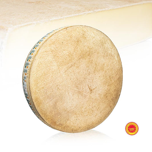 Comté AOP, fromage à pâte dure, affiné 6 mois, roue entière, ca40 kg - Une grande roue de Comté AOP à pâte dure, affiné 6 mois