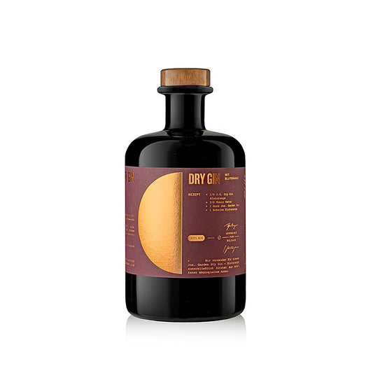 Bouteille de Ehringhausen Jos Garden Dry Gin, orange sanguine, 44 % vol, BIO, 500 ml, avec étiquette dorée et bouteille verte sur fond boisé